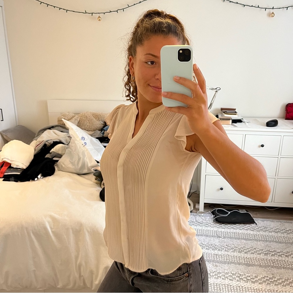 Beige blouse with details in the front